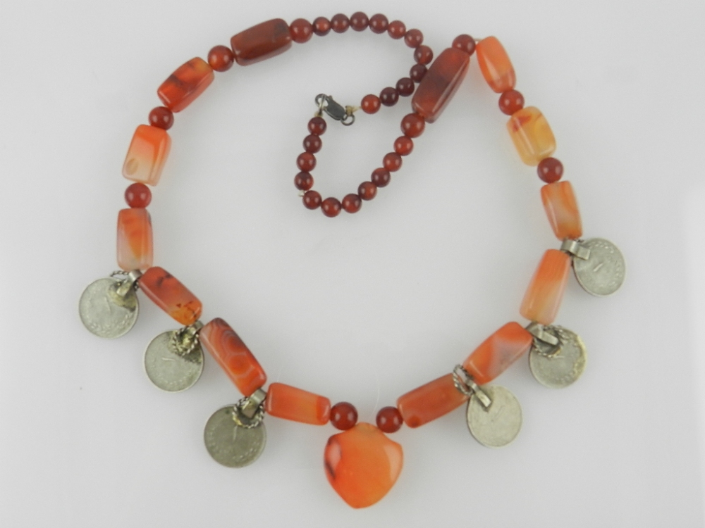 A bloodstone and agate fringe necklace, hung various Middle Eastern coins.