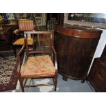 A George III provincial mahogany elbow chair, with vertical bar back, caned seat on square tapered