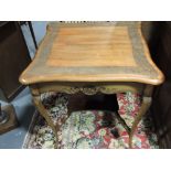 **WITHDRAWN** An Edwardian hardwood occasional table, the shaped square top with ivy-leaf carving