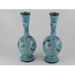 A pair of late Victorian turquoise vitreous vases, decorated with enamels of hawthorne, H. 34cm.