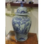 A pair of blue and white baluster shaped vases, decorated with figures in a landscape. (2)