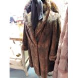 A Russian squirrel fur coat, c.1950, with shawl collar nd unturned cuffs, silk lined.