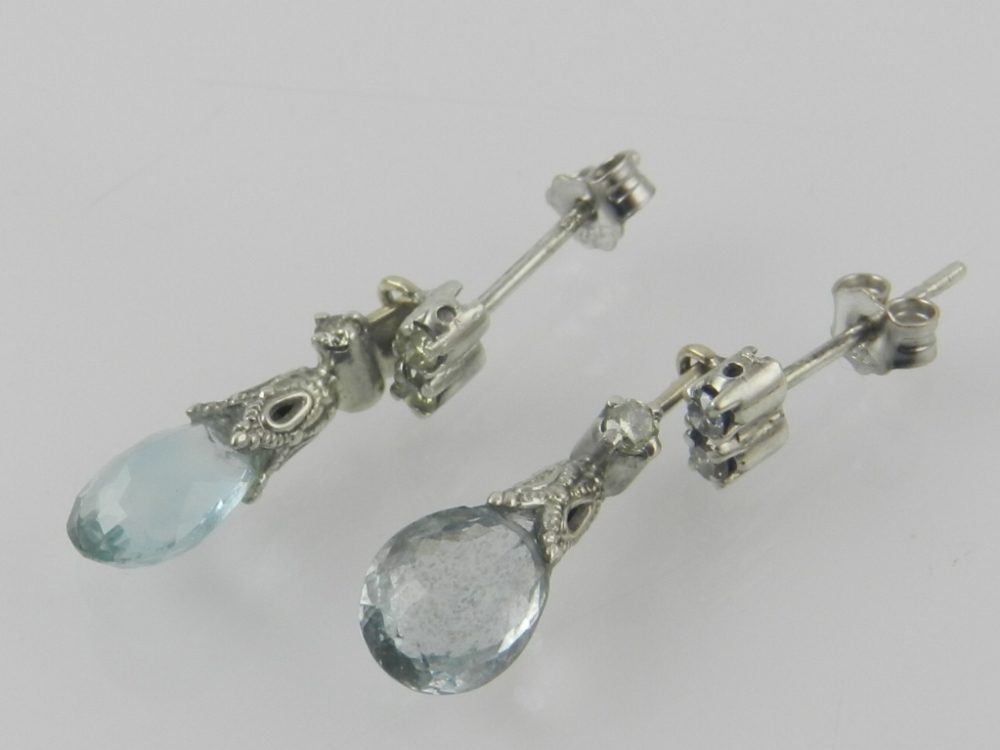 A pair of white metal, diamond and aquam