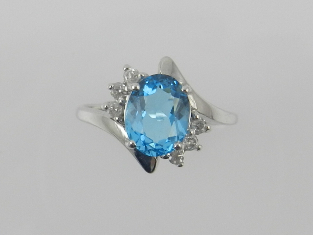 A white metal and blue stone (possibly a