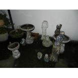 A selection of stone garden ornaments in