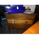 A 1920's oak chest, fitted three long dr