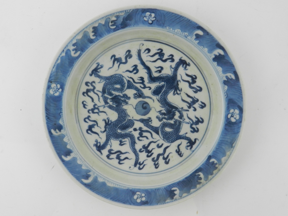 A Chinese blue and white plate, depictin