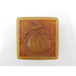 A Chinese soapstone seal, held in a soap