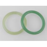 Two green jade bangles. Internal diamete