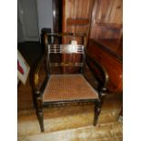 A Regency style elbow chair, parcel gild