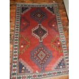 A Persian red ground Hamadan carpet, hav