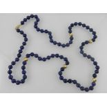 A lapis lazuli beaded necklace intersper