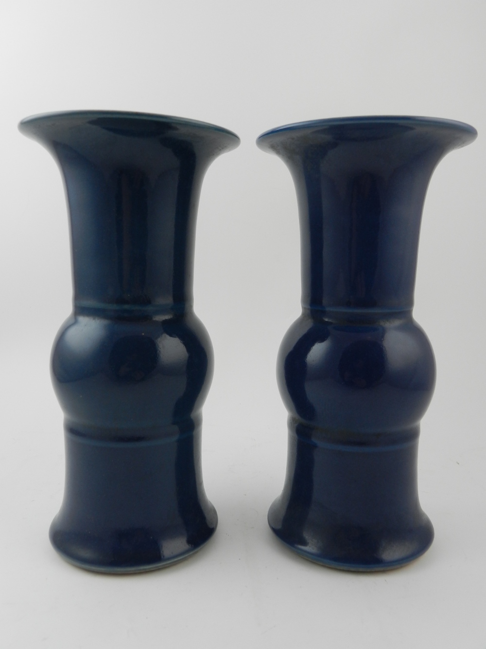 A pair of Chinese Royal blue vases, havi
