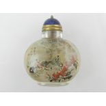 A Chinese reverse painted glass snuff bo