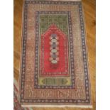 A Persian red and green ground prayer ma