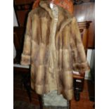 A ladies three-quarter length fur coat