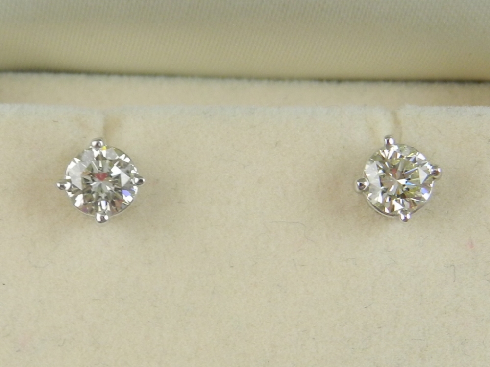 A pair of 14 carat white gold and diamon