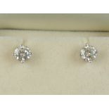 A pair of 14 carat white gold and diamon