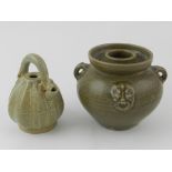 A Chinese green glazed twin handled pot,