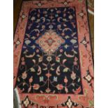 A Persian Hamadan rug, with blue and red