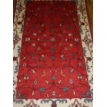 A Persian Hamadan red ground rug, with g