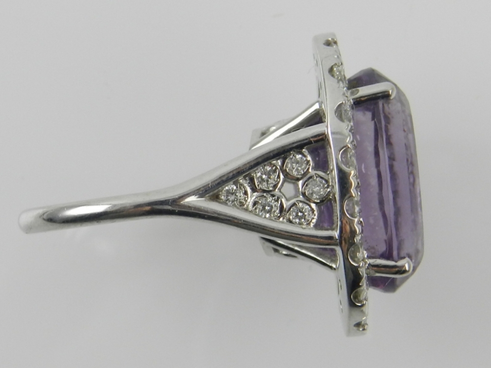 An amethyst and diamond set white metal