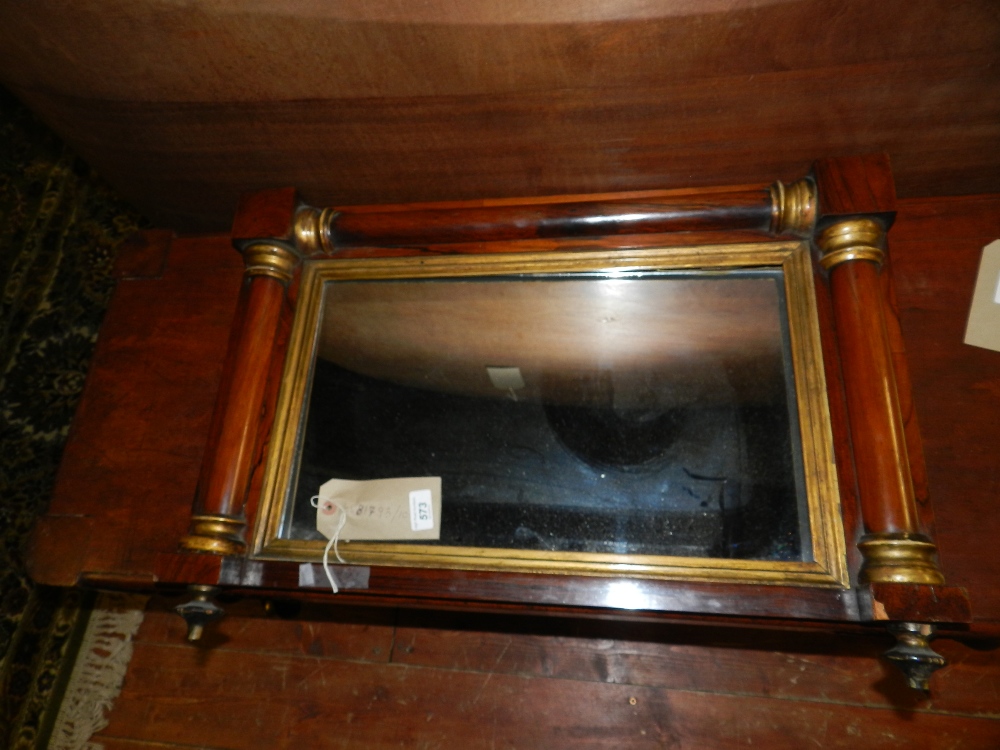 A rosewood overmantle mirror of column f