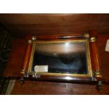 A rosewood overmantle mirror of column f
