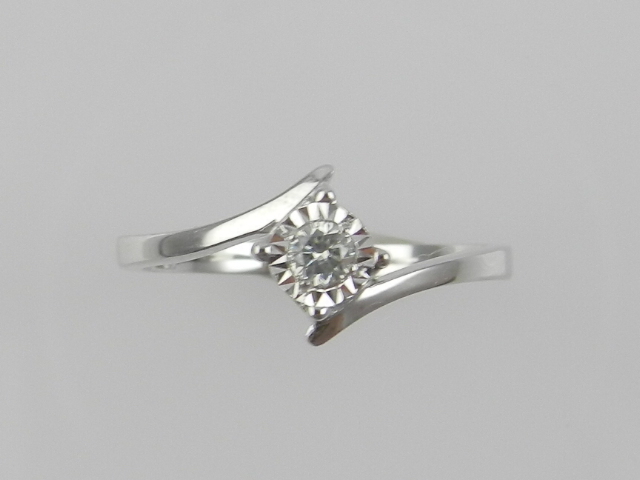 A white metal and illusion set solitaire