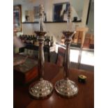 A pair of silver plated table lamps H.56