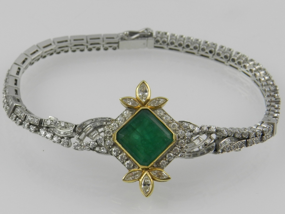 An 18 carat white gold, emerald, and dia