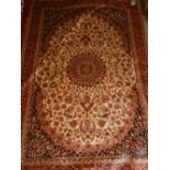 A Persian style part-silk carpet in the