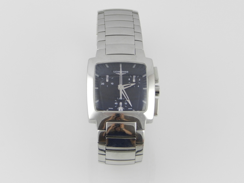 Longines, Switzerland. A gentlemen's stainless steel chronograph wristwatch, the black baton dial