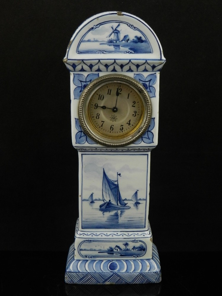 A late 19th/ early 20th century Dutch Delft miniature long case clock, painted in underglaze blue