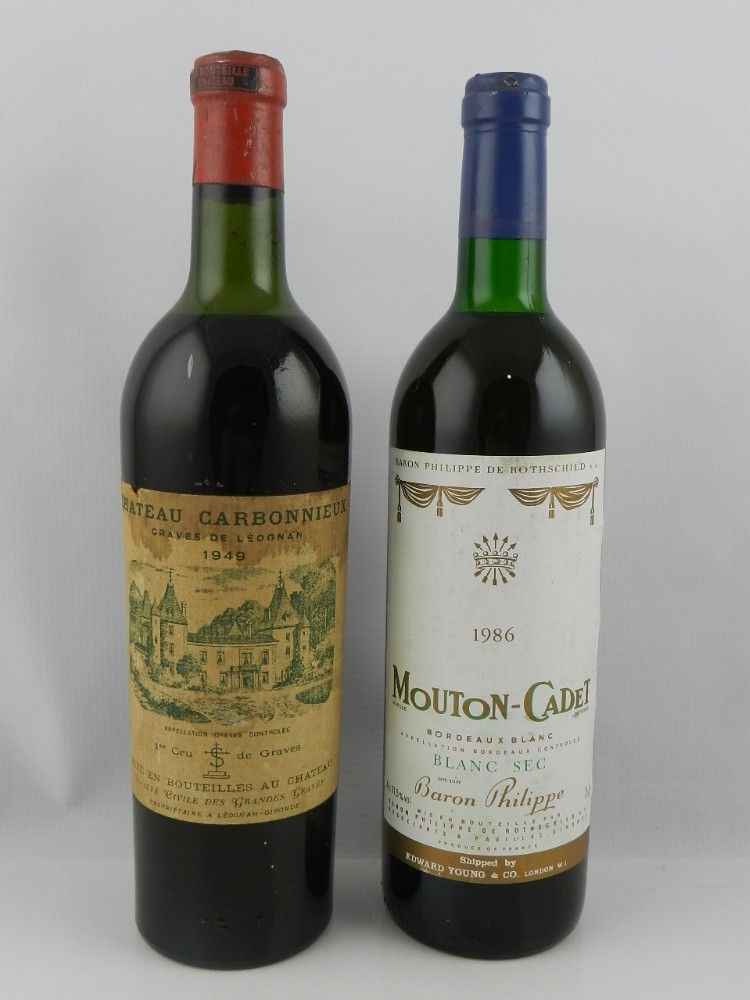 A 1949 Chateau Carbonnieux, Pessac-Leognan, France, together with a 1986 Baron Philippe de