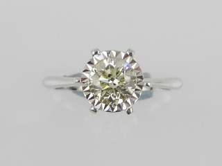 A solitaire diamond ring, centred with an illusion set brilliant cut diamond of approx. 0.93cts.