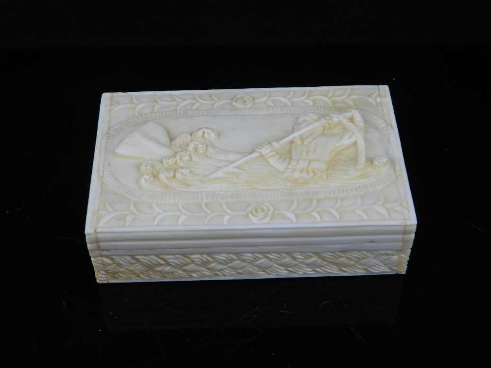 An unusual bone snuff box, the hinged cover relief carved with whaling scene, W. 9.5 cm.