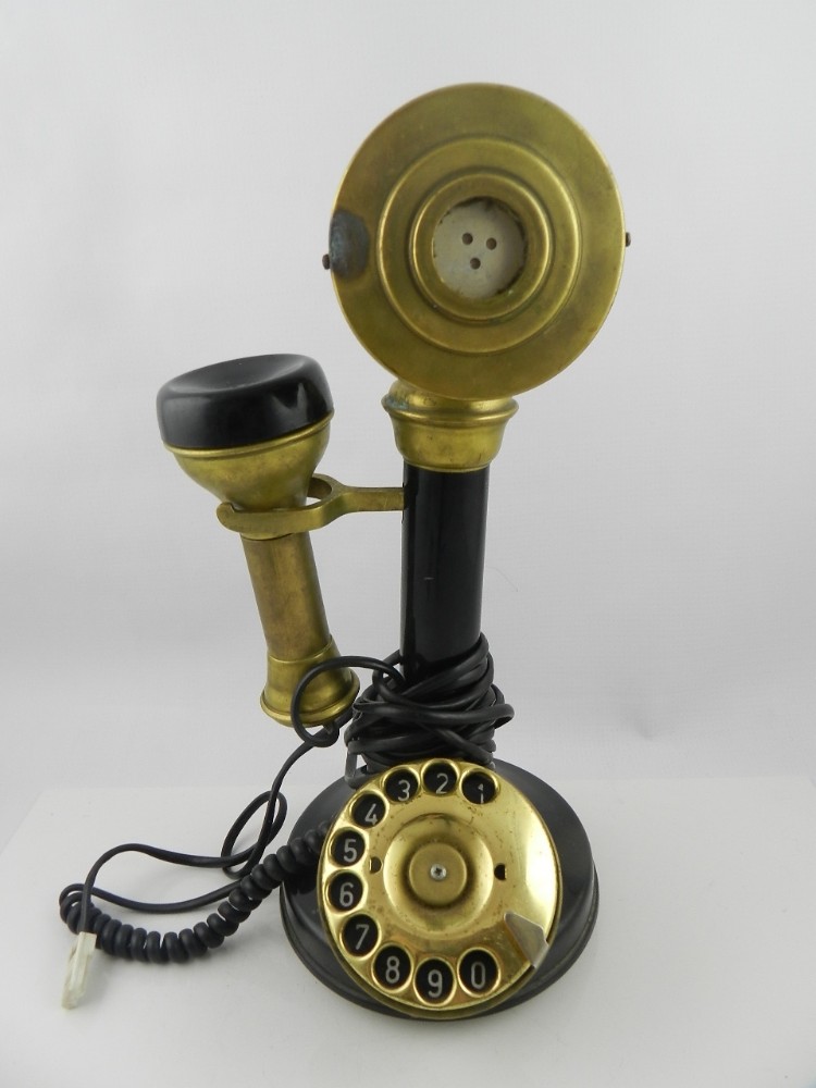 A Victorian style Bakelite and brass candlestick telephone. H: 33cm.