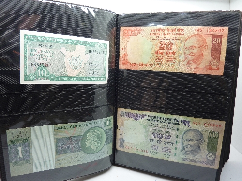 An album of banknotes, Mexico, Bank of India, Brazil, Zambia, etc.