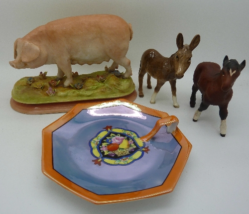 A Beswick Shetland foal, a Beswick donkey, a Noritake candle holder and a continental figure of a