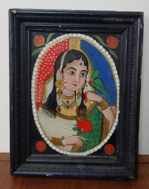 A late 19th/early 20th Century Indian painted portrait of a girl, ebonised frame