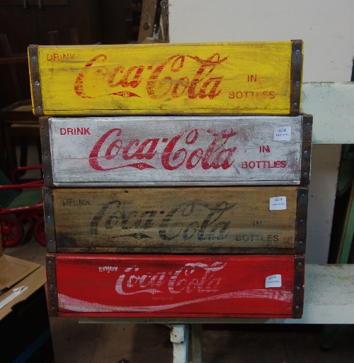 Four Coca-Cola advertising crates