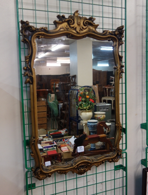 A gilt framed mirror