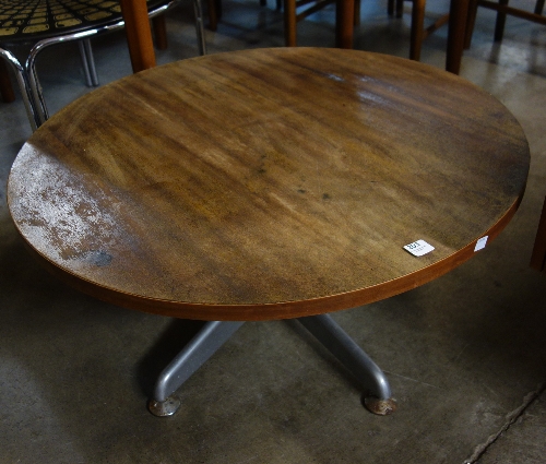 A teak and chrome circular coffee table