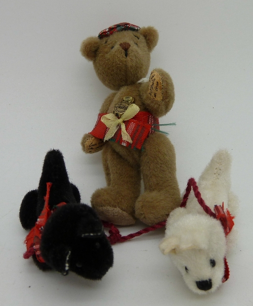 A Hermann limited edition miniature Teddy bear and two miniature Scottie dogs