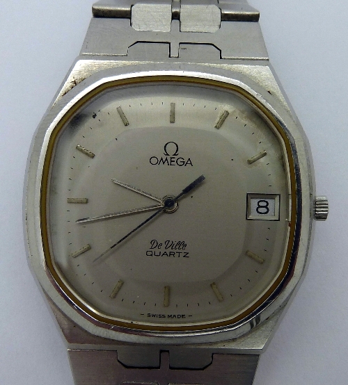 A gentleman`s stainless steel Omega De Ville quartz wristwatch, the silver dial with raised hourly