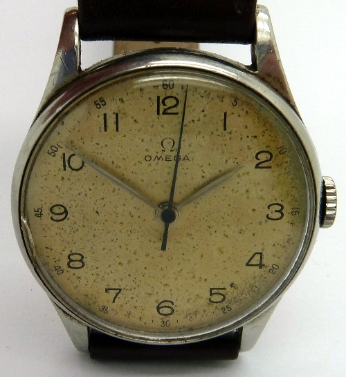 A gentleman`s stainless steel Omega manual wind wristwatch, the circular champagne dial with