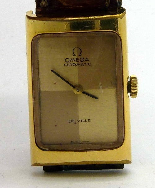 A lady`s plated Omega De Ville automatic wristwatch, the rectangular gold dial signed Omega