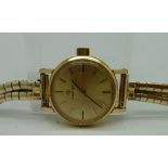 A lady's rolled gold Omega wristwatch on