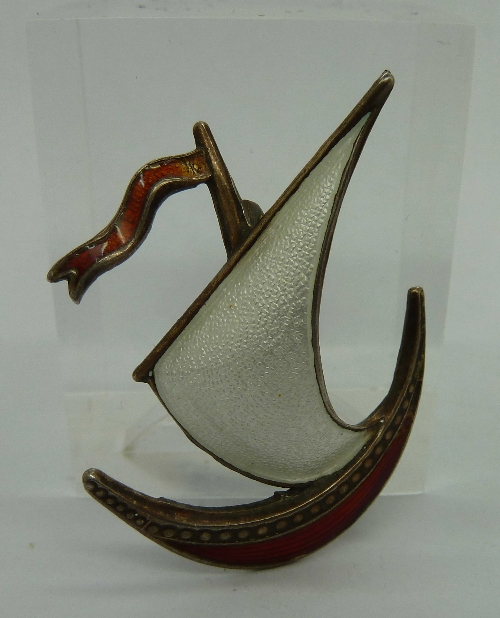 A silver and enamel Viking ship brooch,